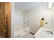 Bright bathroom featuring a tub-shower combo and a white single sink vanity at 5032 Monticello Dr, Columbus, IN 47203