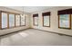 Bright dining room with a bay window, neutral carpet, and a chandelier at 5032 Monticello Dr, Columbus, IN 47203