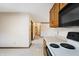 Well-lit kitchen with white countertops and views into the neighboring room at 5032 Monticello Dr, Columbus, IN 47203