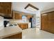 Bright kitchen with wood cabinets, stainless steel refrigerator, and modern appliances at 5032 Monticello Dr, Columbus, IN 47203