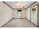 Bright living room featuring a ceiling fan and a large window at 5032 Monticello Dr, Columbus, IN 47203
