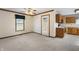 Open concept living room with access to the kitchen and patio at 5032 Monticello Dr, Columbus, IN 47203