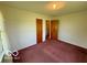 Bedroom with ample closet space, plush carpeting, and natural light at 535 S 450 E, Franklin, IN 46131