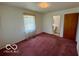 Bedroom with window, closet and view into the bathroom at 535 S 450 E, Franklin, IN 46131