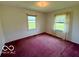 Bright bedroom featuring two windows and comfortable carpeting at 535 S 450 E, Franklin, IN 46131