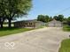 Spacious driveway and two-car detached garage offer convenience and ample parking at 535 S 450 E, Franklin, IN 46131