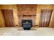 Close-up of a wood-burning fireplace with brick surround and decorative mantel at 535 S 450 E, Franklin, IN 46131