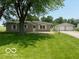 Single-story home with two-car garage, featuring a well-maintained front lawn at 535 S 450 E, Franklin, IN 46131