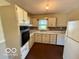 Efficient kitchen layout featuring modern appliances and ample counter space at 535 S 450 E, Franklin, IN 46131