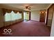 Spacious living room with large window and neutral-toned walls and carpet at 535 S 450 E, Franklin, IN 46131