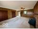 Retro living room with wood paneling and a brick fireplace at 535 S 450 E, Franklin, IN 46131