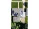 Aerial view displaying the house's layout, solar panels, carport, surrounding properties, and landscaping at 5609 Meadowood Dr, Indianapolis, IN 46224