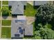 Aerial view showcasing the house with solar panels, carport, well-maintained lawn, and neighborhood at 5609 Meadowood Dr, Indianapolis, IN 46224