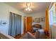 Comfortable Bedroom with a soft chair, wooden changing table, and window with bright curtains at 5609 Meadowood Dr, Indianapolis, IN 46224