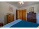 Comfortable bedroom with hardwood floors and charming wooden dressers at 5609 Meadowood Dr, Indianapolis, IN 46224