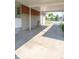 Attached carport features brick and stone facade and concrete drive, offering covered parking for residents and guests at 5609 Meadowood Dr, Indianapolis, IN 46224