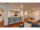 View of the wet bar, seating area, play area, and white doors in the basement at 5609 Meadowood Dr, Indianapolis, IN 46224