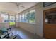 Enclosed porch with multiple windows offering great outdoor views and natural light at 5609 Meadowood Dr, Indianapolis, IN 46224