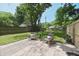 Spacious backyard with paver patio, green grass, chairs and fire pit at 5636 Crittenden Ave, Indianapolis, IN 46220