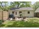 Charming backyard patio area with comfortable seating and well-maintained lawn at 5636 Crittenden Ave, Indianapolis, IN 46220