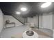 Basement featuring recessed lighting, a seating area, and a decorative table at 5636 Crittenden Ave, Indianapolis, IN 46220
