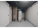 Basement features a hot water tank and updated utilities at 5636 Crittenden Ave, Indianapolis, IN 46220