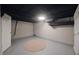 Basement area showcasing a neutral rug and black ductwork at 5636 Crittenden Ave, Indianapolis, IN 46220