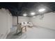Finished basement with a comfortable seating area and a neutral color palette at 5636 Crittenden Ave, Indianapolis, IN 46220