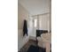 Cozy bathroom features black and white decor, ceramic tile, pedestal sink, and shower at 5636 Crittenden Ave, Indianapolis, IN 46220
