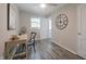 Bright bedroom featuring desk and chair with a view of a clock and the backyard at 5636 Crittenden Ave, Indianapolis, IN 46220
