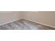 Neutral toned bedroom shows wood-look floors and white painted trim at 5636 Crittenden Ave, Indianapolis, IN 46220