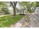 Charming single-story home with a well-maintained front lawn and a gravel driveway at 5636 Crittenden Ave, Indianapolis, IN 46220