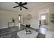 Inviting living room features a ceiling fan, a round mirror and an open floor plan at 5636 Crittenden Ave, Indianapolis, IN 46220
