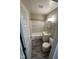 Neat bathroom with shower and tub combination, modern fixtures, and wood-look flooring at 5704 N Keystone Ave, Indianapolis, IN 46220