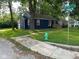 Inviting home exterior features colorful accents, green lawn, and street view at 5704 N Keystone Ave, Indianapolis, IN 46220