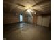 Spacious garage with two garage doors and a ceiling fan at 5704 N Keystone Ave, Indianapolis, IN 46220