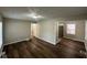 Open living room featuring new flooring and neutral paint at 5704 N Keystone Ave, Indianapolis, IN 46220