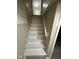 Bright stairway with freshly painted white stairs and neutral-toned walls leading to an upper level at 5704 N Keystone Ave, Indianapolis, IN 46220