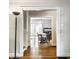 View through doorway of dining area with hardwood floors and a chandelier at 5919 Central Ave, Indianapolis, IN 46220