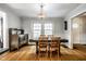 Inviting dining room featuring hardwood floors and vintage hutch with natural light at 5919 Central Ave, Indianapolis, IN 46220
