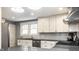 Modern kitchen featuring subway tile backsplash, sleek countertops, and stainless steel appliances at 5919 Central Ave, Indianapolis, IN 46220