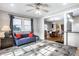 Comfortable living room with a ceiling fan, ample natural light and stylish floor tiles at 5919 Central Ave, Indianapolis, IN 46220