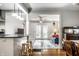 Open-concept living space connecting dining area to kitchen with natural light at 5919 Central Ave, Indianapolis, IN 46220
