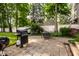 Outdoor patio with grill and seating, ideal for backyard gatherings at 5919 Central Ave, Indianapolis, IN 46220