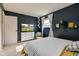 A bedroom featuring a full sized bed, natural lighting, and a television at 5923 W 29Th Pl, Indianapolis, IN 46224