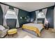 This room features a full sized bed and natural lighting at 5923 W 29Th Pl, Indianapolis, IN 46224