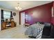 Bright dining room with a black accent wall and dining table at 5923 W 29Th Pl, Indianapolis, IN 46224