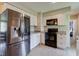 A bright kitchen featuring white cabinets, granite countertops, and stainless steel appliances at 5923 W 29Th Pl, Indianapolis, IN 46224
