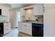Updated kitchen with granite countertops, stainless steel sink, and white cabinets at 5923 W 29Th Pl, Indianapolis, IN 46224