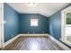 Cozy bedroom with great natural light, neutral paint, and laminate flooring at 602 Prospect St, Indianapolis, IN 46203